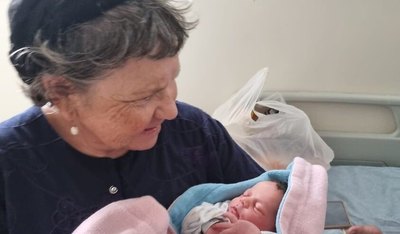 Marcelle Taljah, seen with her new granddaughter on October 6, a day before she was murdered. (Courtesy)