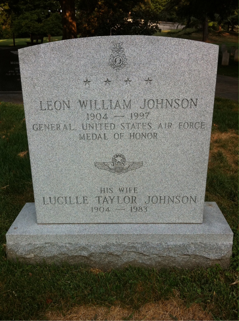 Headstone shared by 2 interments, including Leon W. Johnson