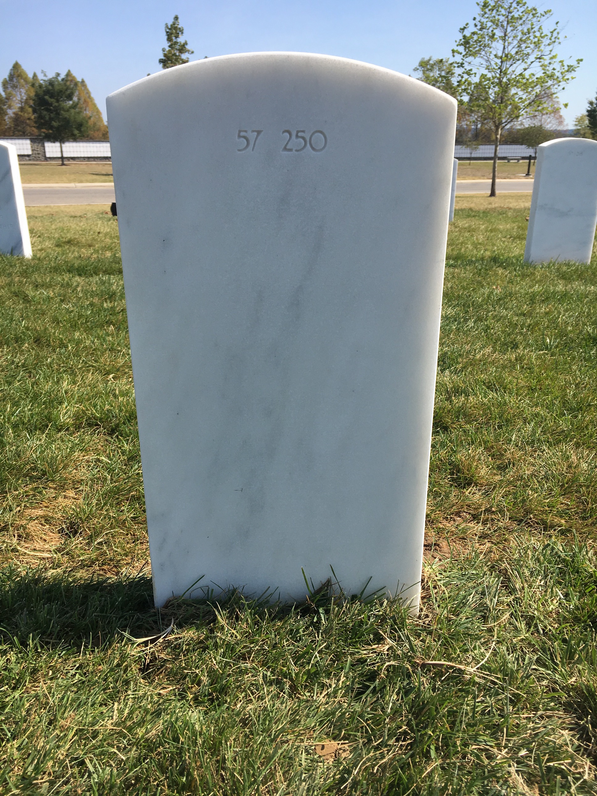 Back of headstone — Lawrence Atoigue