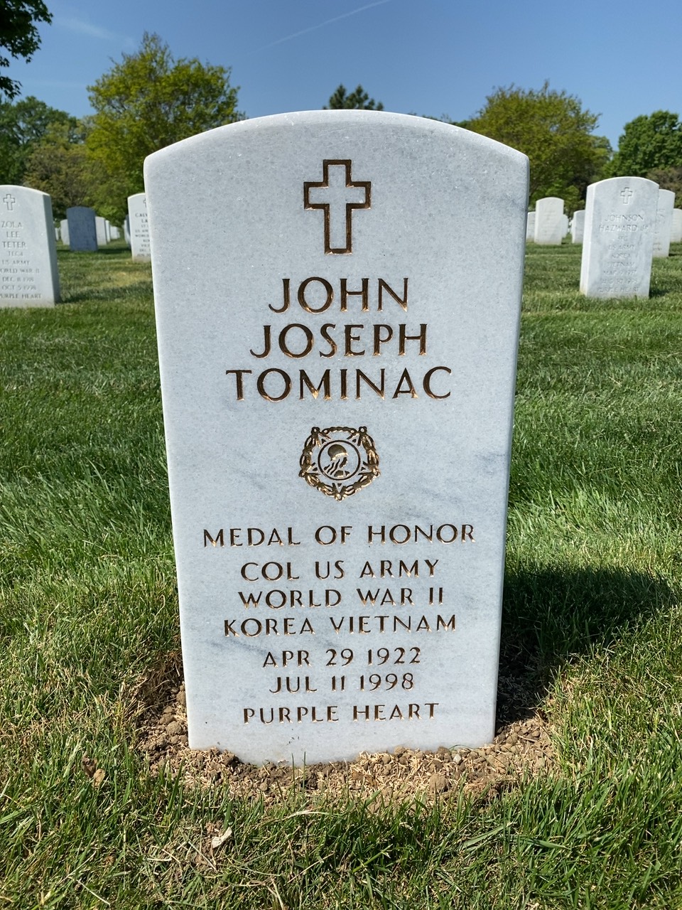 Headstone shared by 2 interments, including John J. Tominac
