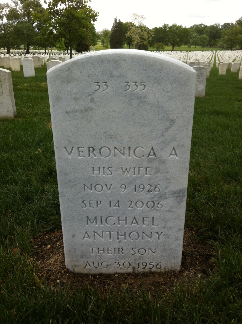 Back of headstone — Regis Nelis