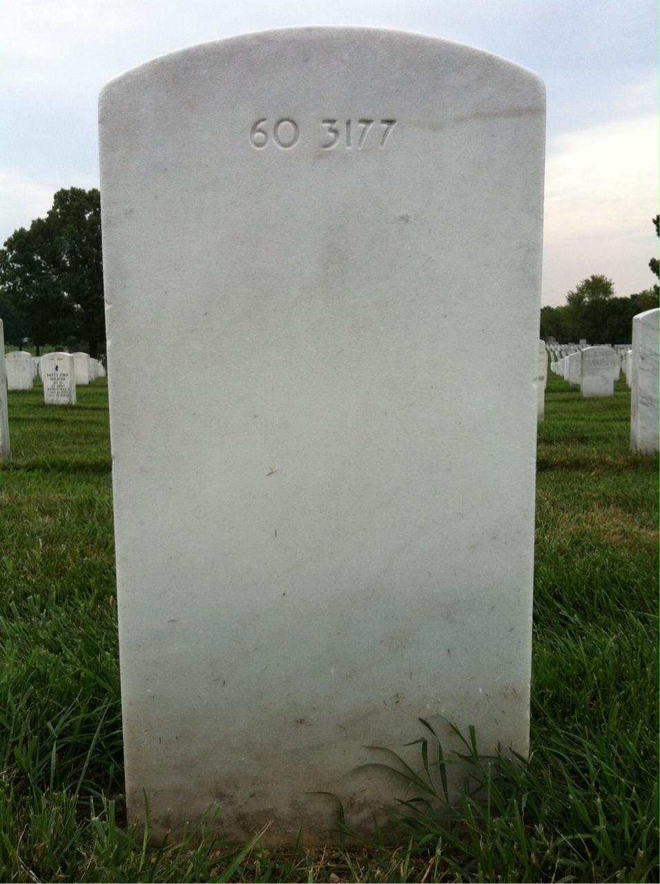 Back of headstone — Rushern Baker
