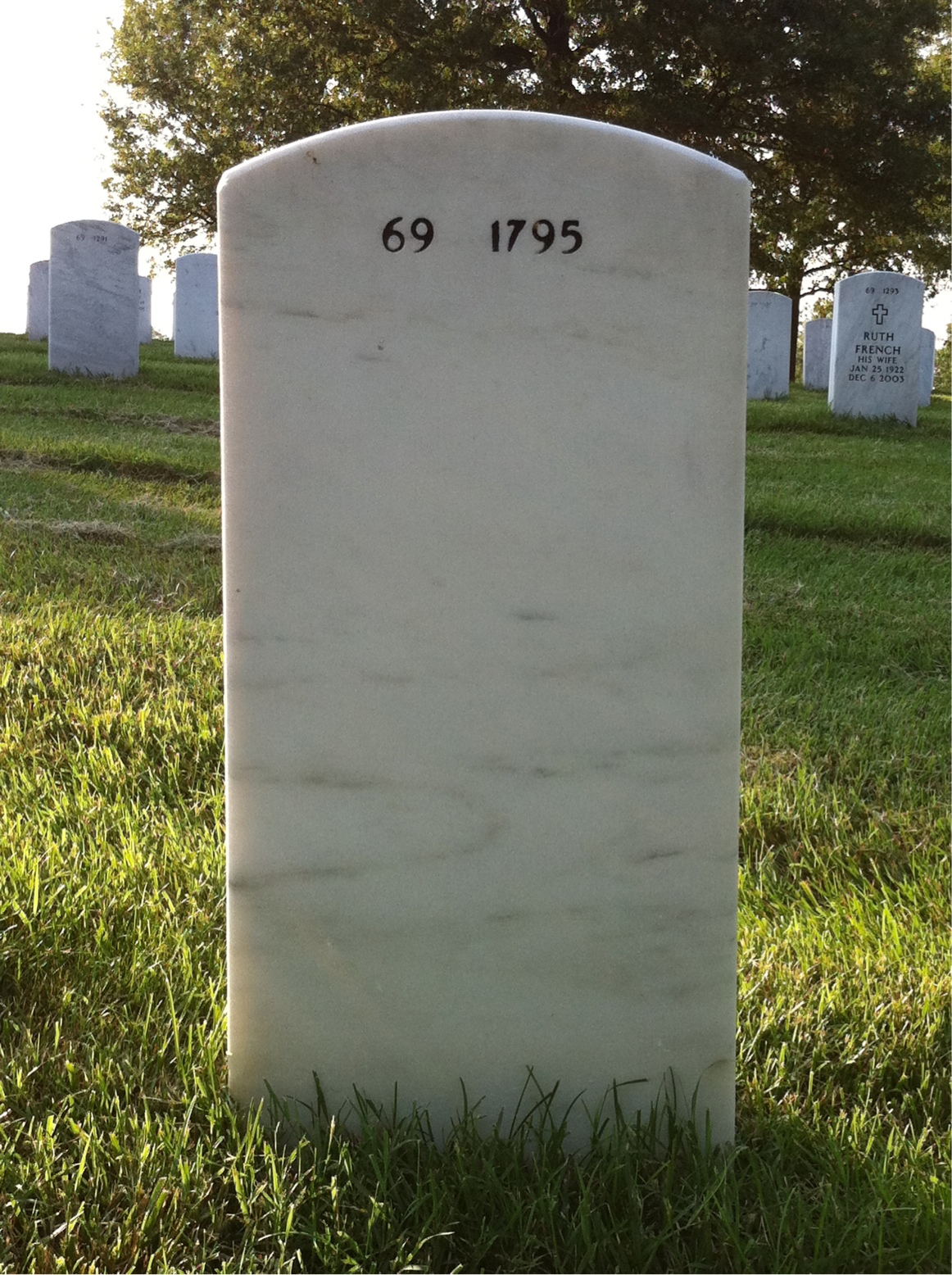 Back of headstone — John Kjensmo