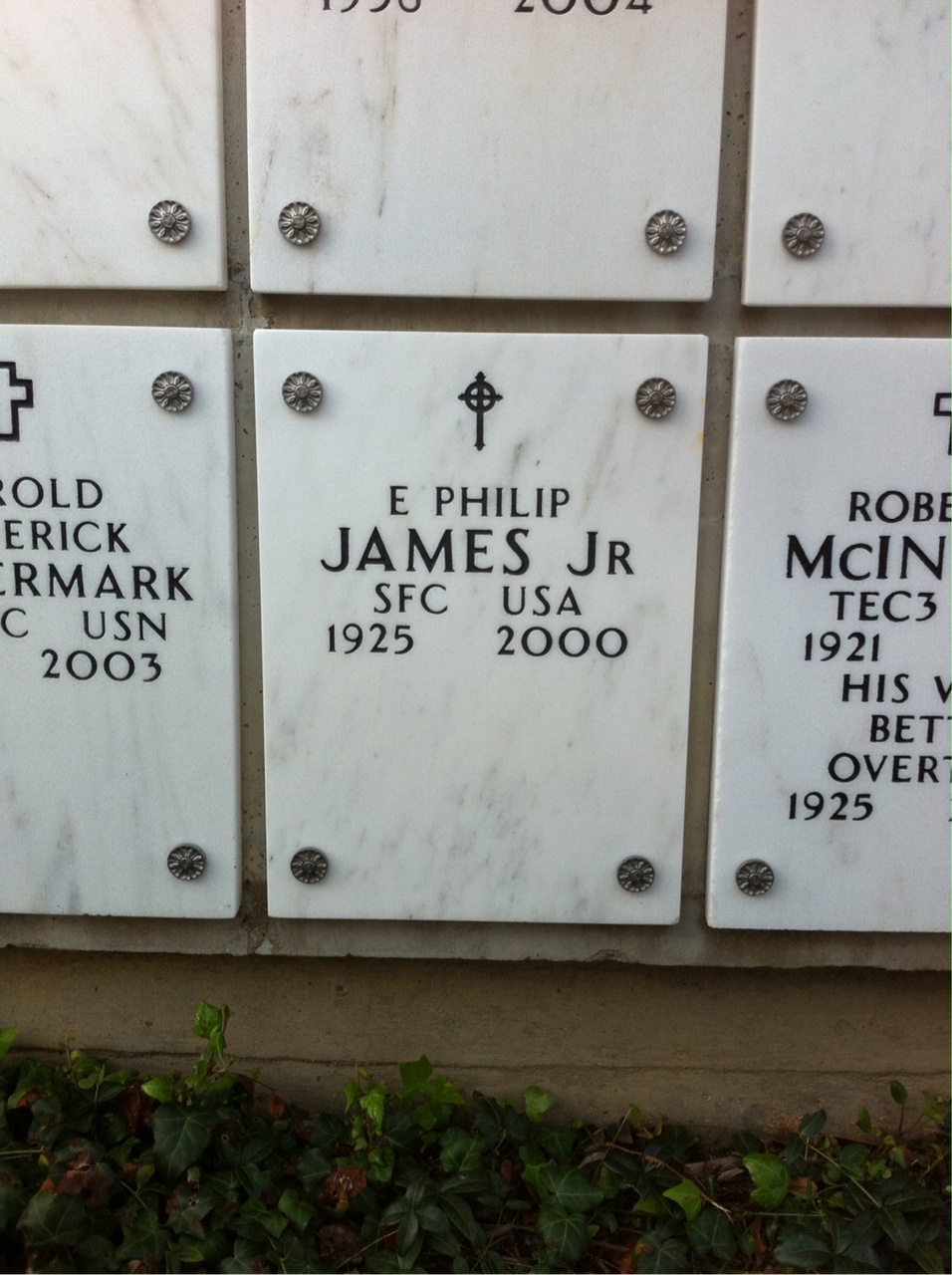 E James