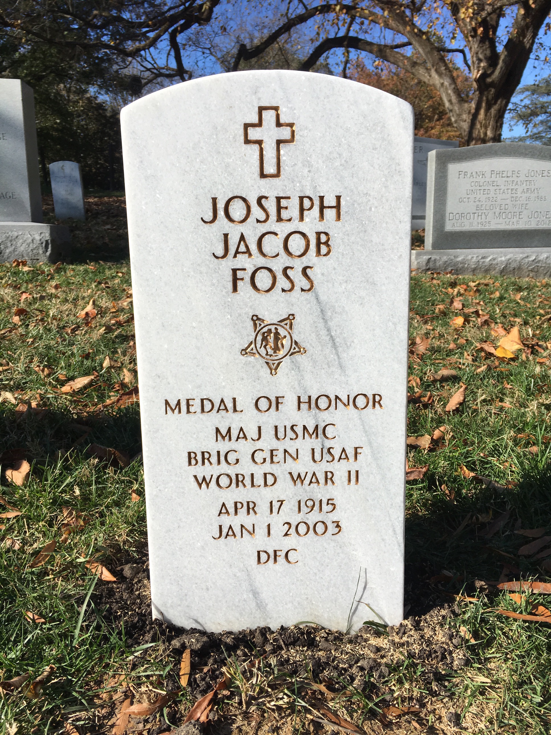 Headstone shared by 2 interments, including Joseph J. Foss