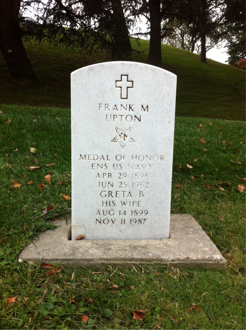 Headstone shared by 3 interments, including Frank M. Upton