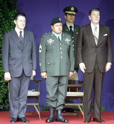 Army Master Sgt. Roy P. Benavidez (center) is flanked by United States Secretary of Defense Caspar Weinberger (left) and US President Ronald Reagan at his Medal of Honor presentation ceremony in 1981.