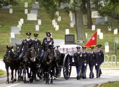 Soldiers of the U.S. 3rd infantry escort the casket of Army LTG Timothy J. Maude
