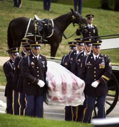 Soldiers of the U.S. 3rd infantry escort the casket of Army LTG Timothy J. Maude